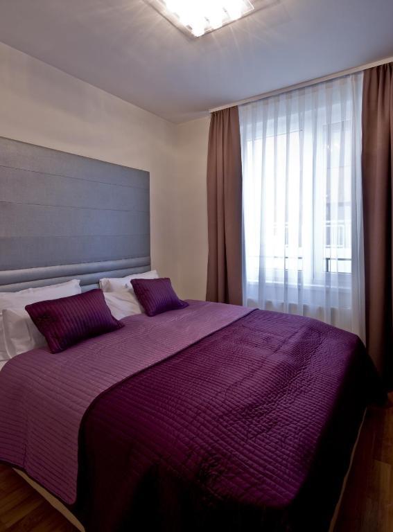 Corvin Lux Aparthotel Budapeste Quarto foto